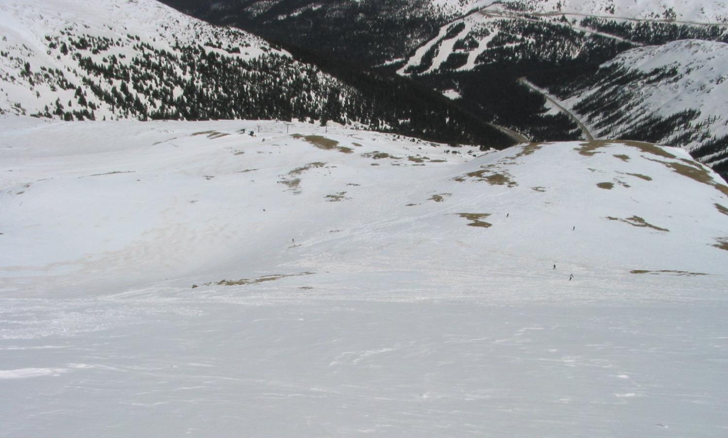 Looking down on the Field of Dreams from the North Ridge off Chair Nine.  The top of Lift Eight can be seen almost one thousand vertical feet below.  Skiers below on the top of Tickler provide some sense of the vast open space in Field of Dreams.