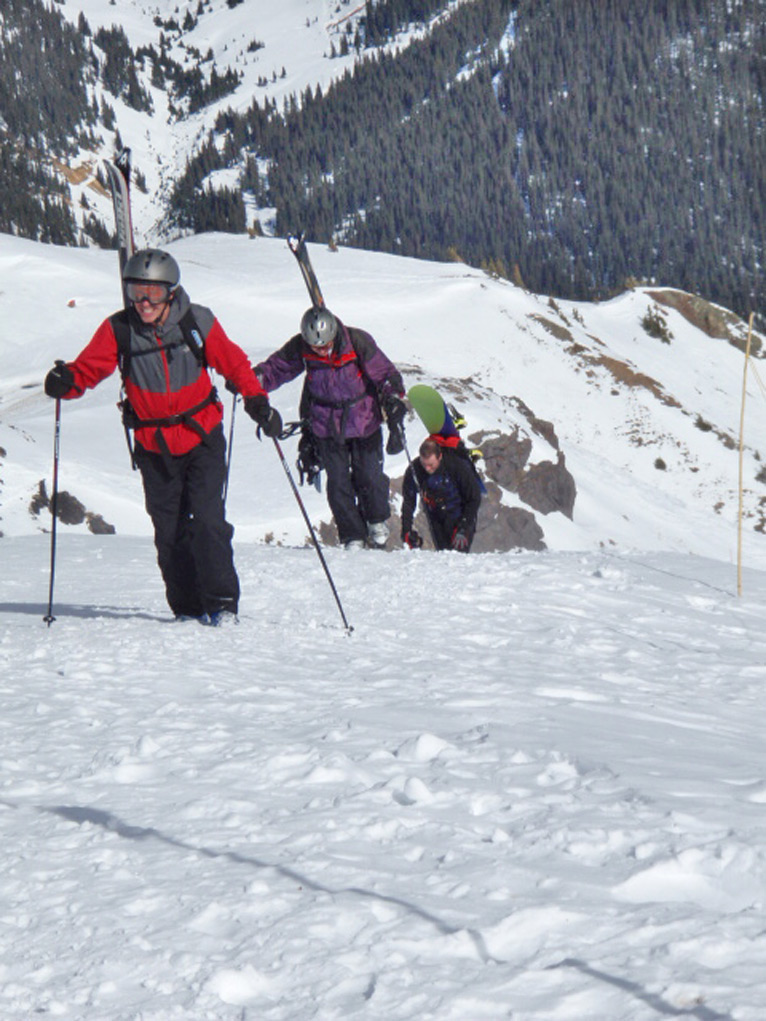 Skiers Hike Uphill